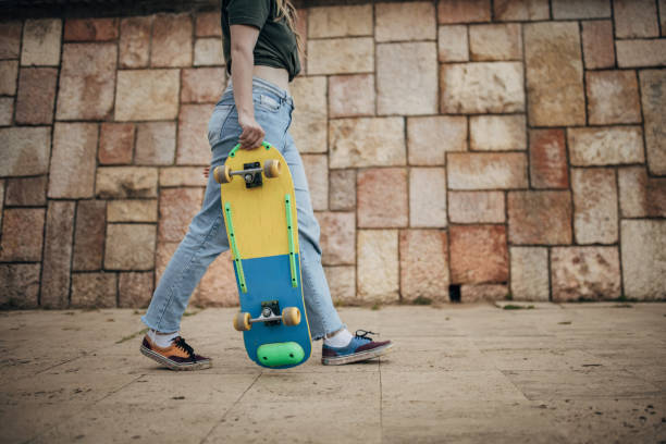 istock Young woman with skateboard 1600733250