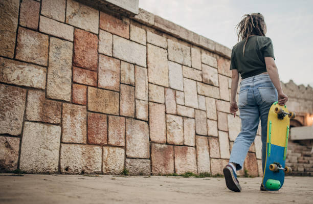 Young woman with skateboard