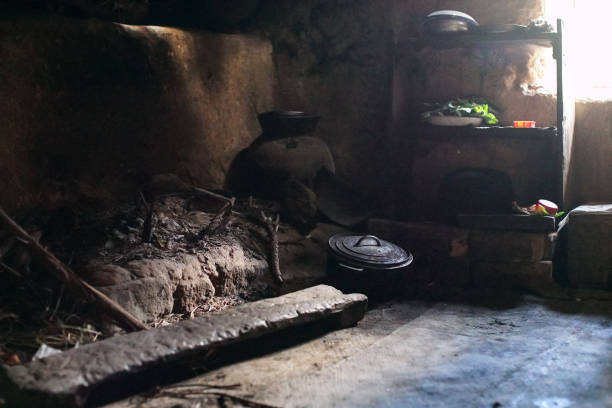 istock Interior of typical Madagascar house with simple cooking place, everything dark, only some light entering through small window 1600744239
