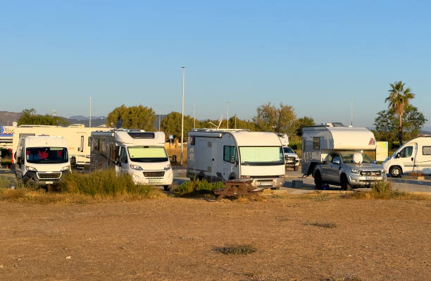 istock Campervan in camp parking near beach at coastline. 1600754454