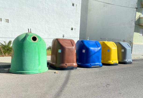 istock Garbage cans on street at building.  Garbage bins for rubbish. 1600757726