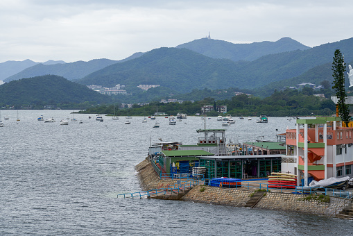 Seaside town buildings and mountains in Tai Po, Hong Kong