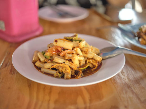 istock Lotus stem spicy salad  . THAI NAME  Som Tum Sai Bua 1600770708