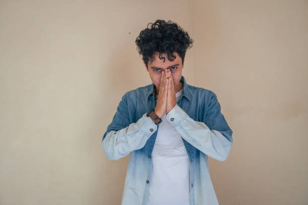 istock Young curly man wear denim clothes with depression face. 1600777835