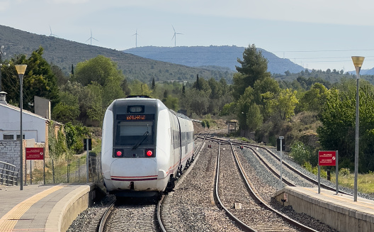 High-speed regional train at Caudiel railway station. High-speed railway, Spanish National Rail Network. High-speed passenger train on railroad. Spain public transport.