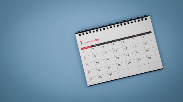 istock White calendar laying on blue background planning concept. 1600797044