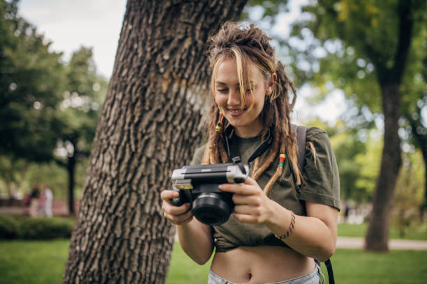 istock Young woman with camera 1600818693