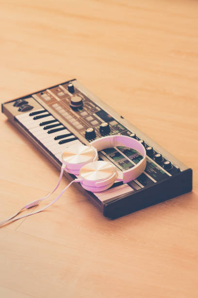 istock white headphone on synthesizer keyboard. music background 1600833761