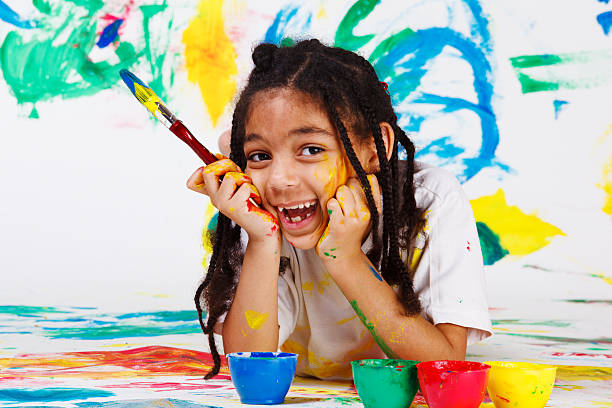幸せなアフリカ系アメリカ人の女性 - child multi colored painting art ストックフォトと画像
