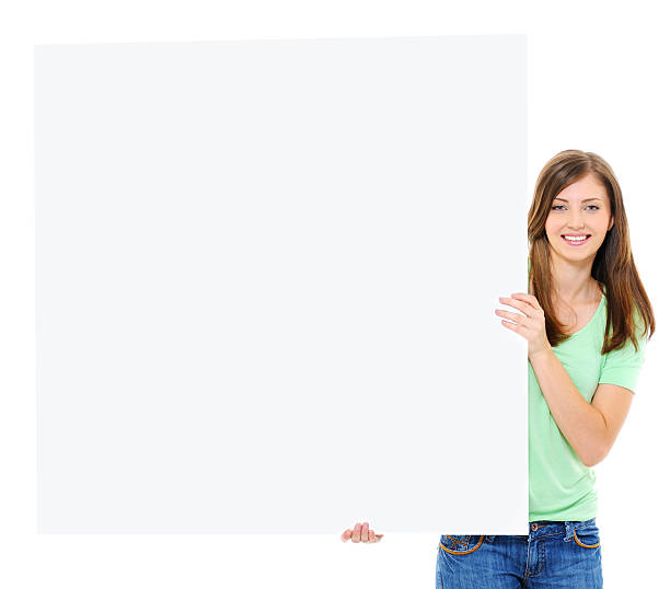 istock Happy young female holding big blank banner 160083910