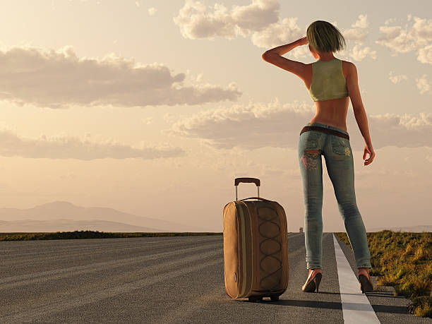 istock woman with bag wait on roadside 160084725