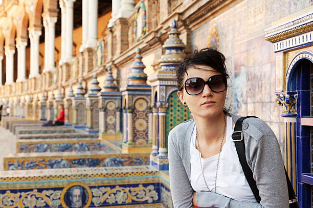 Real Caucasian Woman is sitting in Seville . stock photo