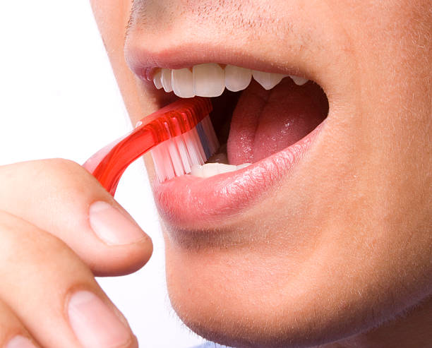 istock Man, brushing teeth with a red tooth brush 160085108