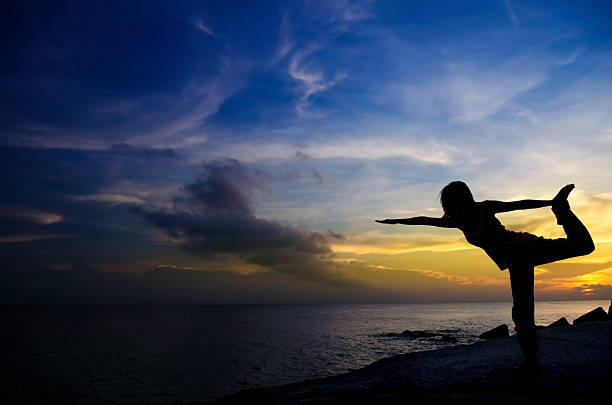 istock Silhouette of Woman Practicing Yoga 160085430