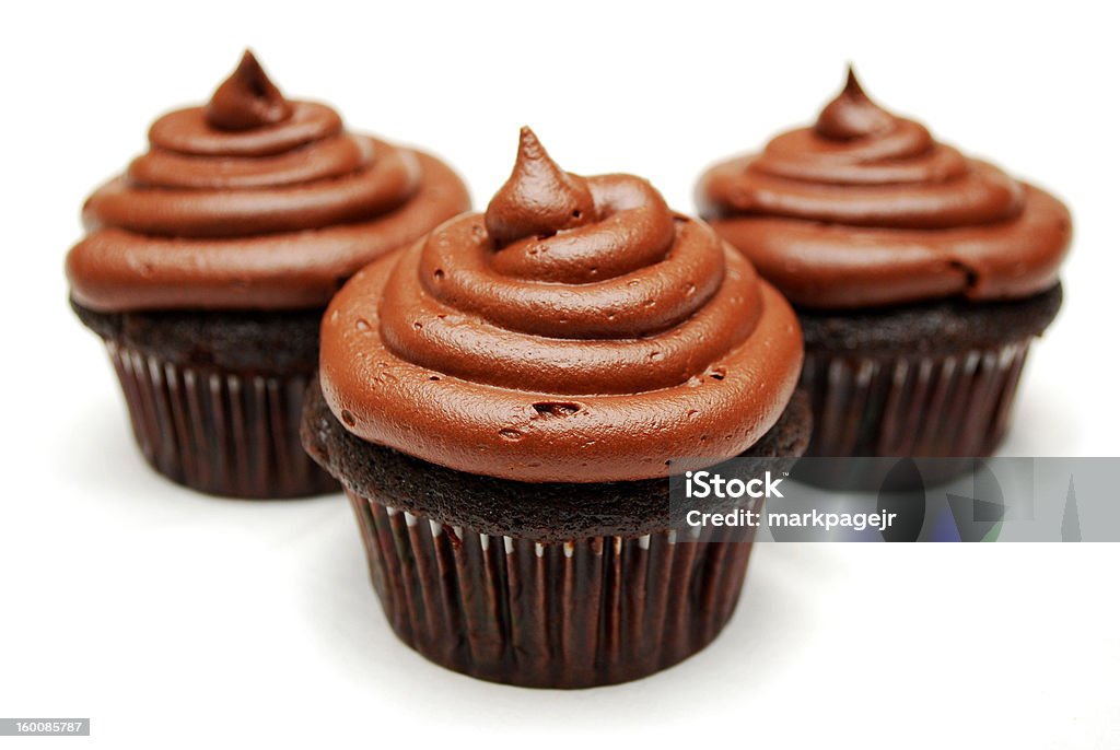 Chocolate Cupcakes These are chocolate cupcakes with a chocolate ganache on top. Brown Stock Photo