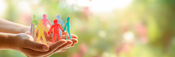 Diversity Inclusion And Equality Concept - Paper People Silhouettes On Hands Social Inclusion Concept - Paper People Silhouettes On Hands equality stock pictures, royalty-free photos & images
