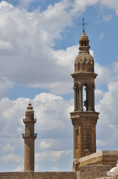 istock church tower bell and mosque minaret, mardin, turkey 1600865477