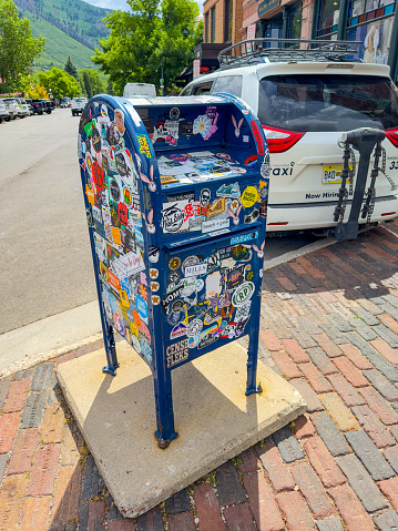 Aspen, CO, USA - July 27, 2023: USPS mailbox with stickers all over