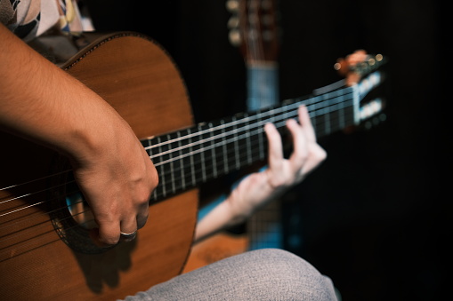 The Enchanting Moment of the Guitar: This captivating shot captures the imprint of fingers touching the guitar strings. Beginning with the gentle touch of the notes, melodies narrate the magic of music. This moment, inviting us to pause and listen to the story of the notes for a brief second, is a narrative in the universal language of music.