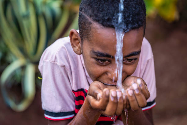 istock African young boy drinking fresh water, East Africa 1600875680