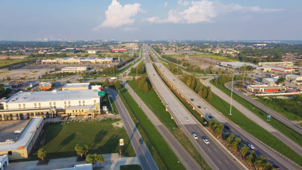 istock Aerial view busy Interstate Highway 10 (I-10) intersection with Crowder boulevard with gas station, restaurant, hotel buildings, grocery stores near downtown Little Woods New Orleans USA 1600876726