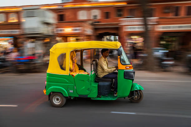 istock Indian man drives auto rickshaw (tuk-tuk), India 1600885221