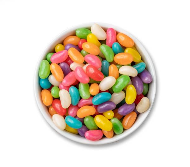istock Colorful jelly beans in a bowl isolated over white background 1600893949
