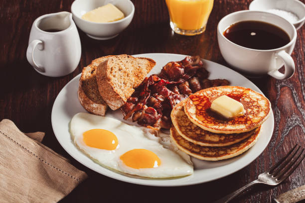 istock traditional full american breakfast eggs pancakes with bacon and toast 1600895367