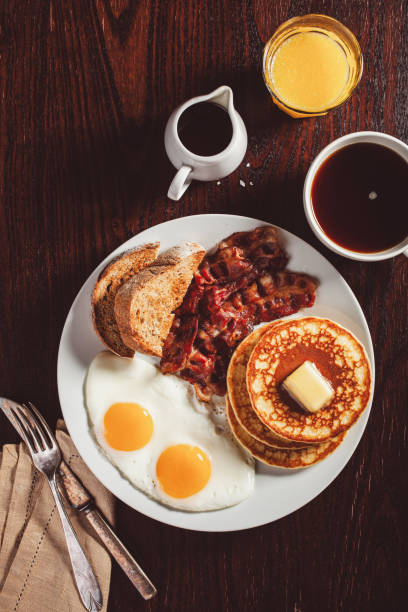 istock traditional full american breakfast eggs pancakes with bacon and toast 1600895379