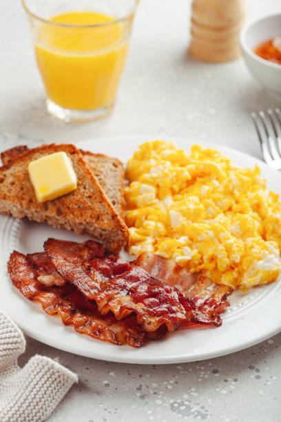 istock traditional scrambled egg breakfast with bacon and toast 1600895895