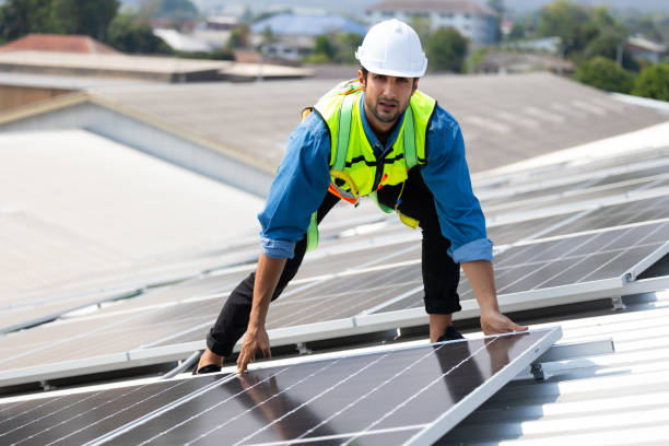 istock electrical engineering man Installing Solar Cell panels on Roof. Solar energy clean and green alternative energy concept. 1600900967
