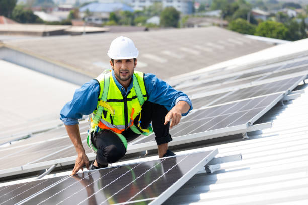 istock electrical engineering man Installing Solar Cell panels on Roof. Solar energy clean and green alternative energy concept. 1600901525