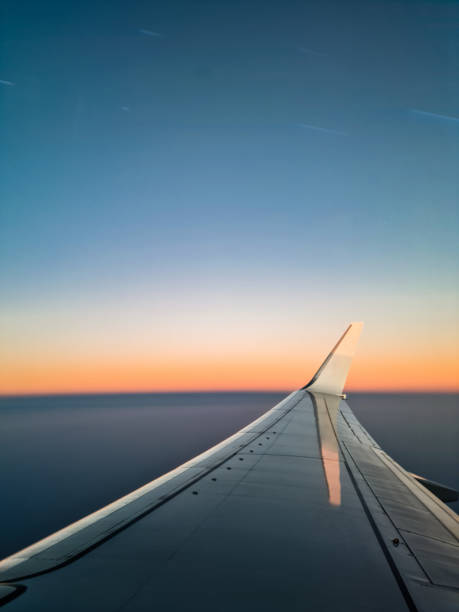 view from the airplane window mid-air - cloud mid air cloudscape aerial view imagens e fotografias de stock