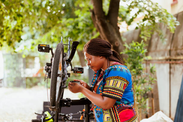 istock Woman repairing bicycle frame 1600912982