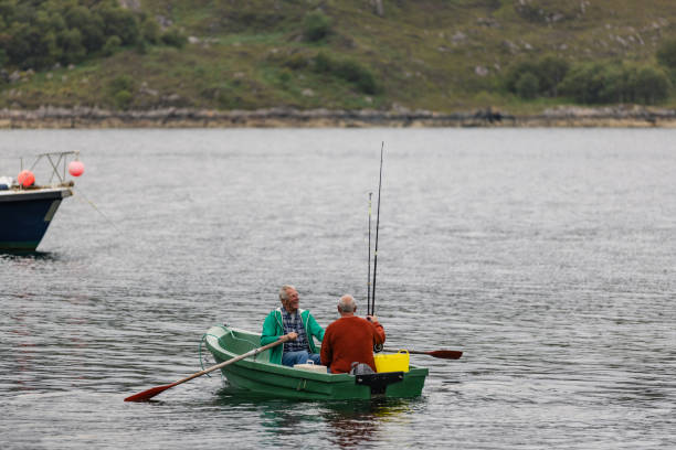 Father and child enjoying tranquil boat ride on lake surrounded by lush, green forest with calm water reflecting trees. Enjoying serene and peaceful environment while bonding
