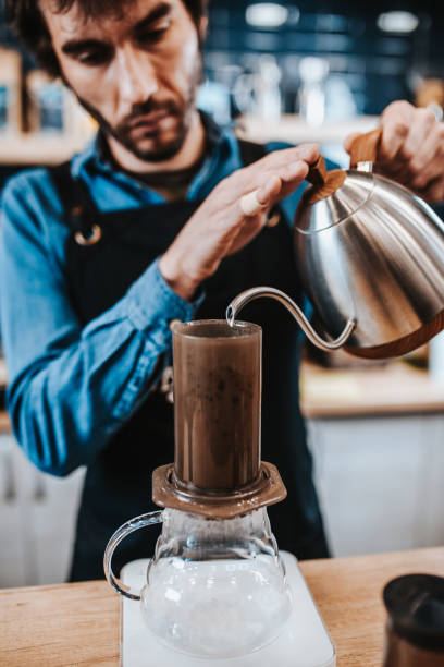 istock Close-up of a male hand with coffee utensils while making coffee 1600927578