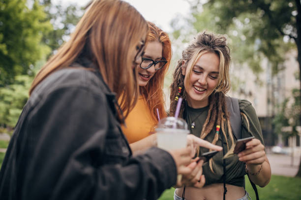 istock Friends looking polaroid pictures 1600928175