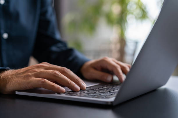 istock Businessman hands using laptop in office 1600932150