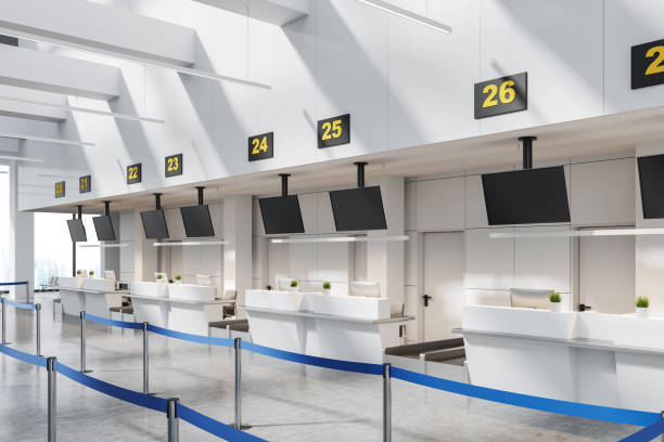 istock Airport interior with check-in zone and registration desk with monitors 1600948693