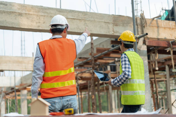 istock Engineers team use laptop and check the blueprint on site. Contractor and inspector inspection construction during project.civil Forman check quality assurance. Audit, inspect, quality control. 1600950905