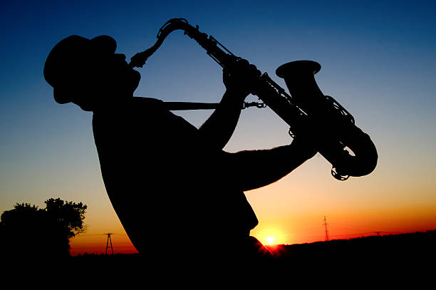 istock Saxophonist at sunset 160098581
