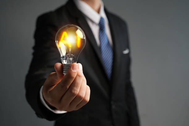 istock Businessman showing graphics on virtual hands. Global Internet connected with AI, Artificial Intelligence to help solve work problems and improve work efficiency and organization. 1600998765