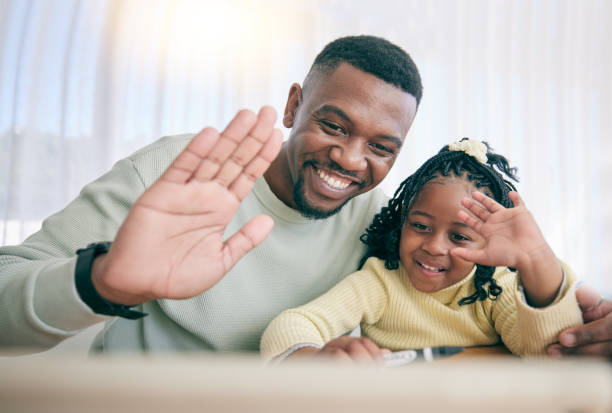 istock Video call, black family and online education with father support for child development, e learning and welcome to webinar. Hello, wave and happy dad or man with kid for elearning platform discussion 1600999891
