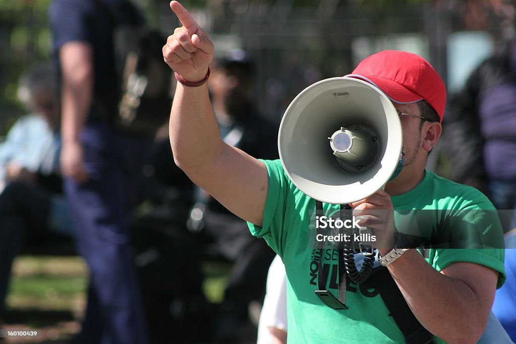 protest Protester pointing finger and holding megaphone Protest Stock Photo
