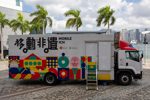 Miami, Florida August 17,2019 multiple blue Amzon prime trailers backed into bays at a distribution center to unload products for area customers.