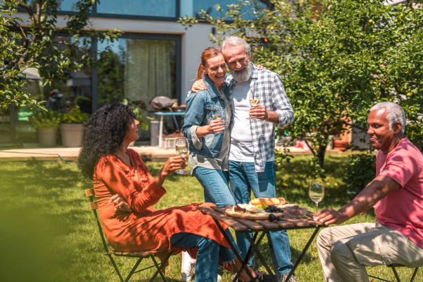istock Sunny Backyard Get-Together With Joyful Senior Couples 1601038356