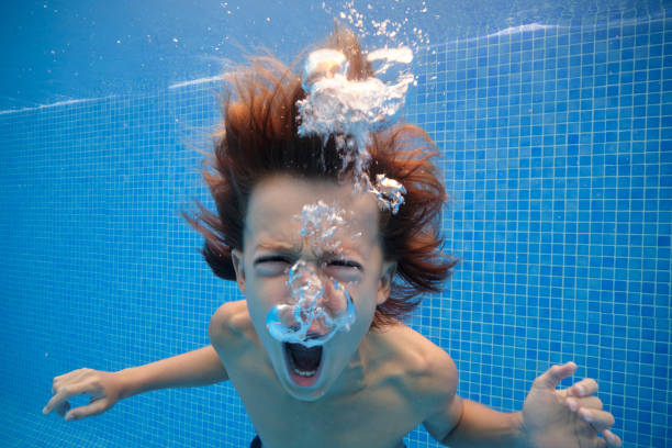 istock Furious boy yelling in swimming pool 1601038938