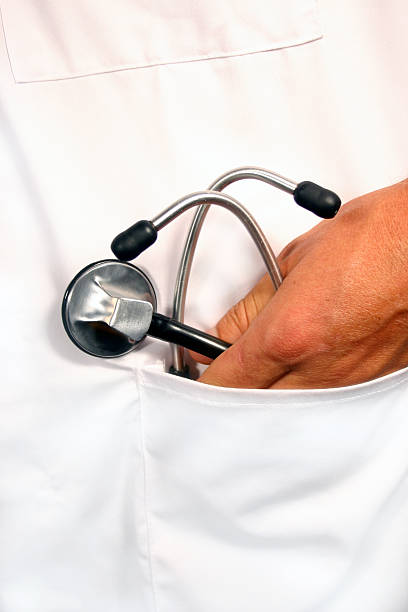 Stethoscope in pocket stock photo