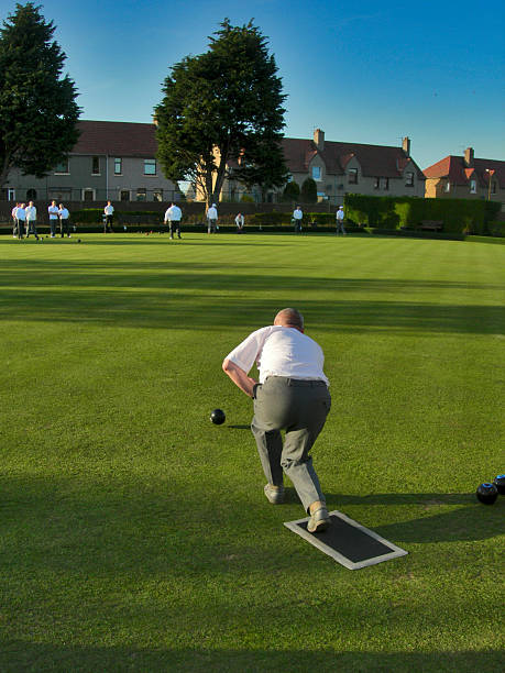 istock Lawn Bowls Team Player playing his shot 160104437