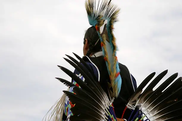 Native American dancer at traditional pow-wow.